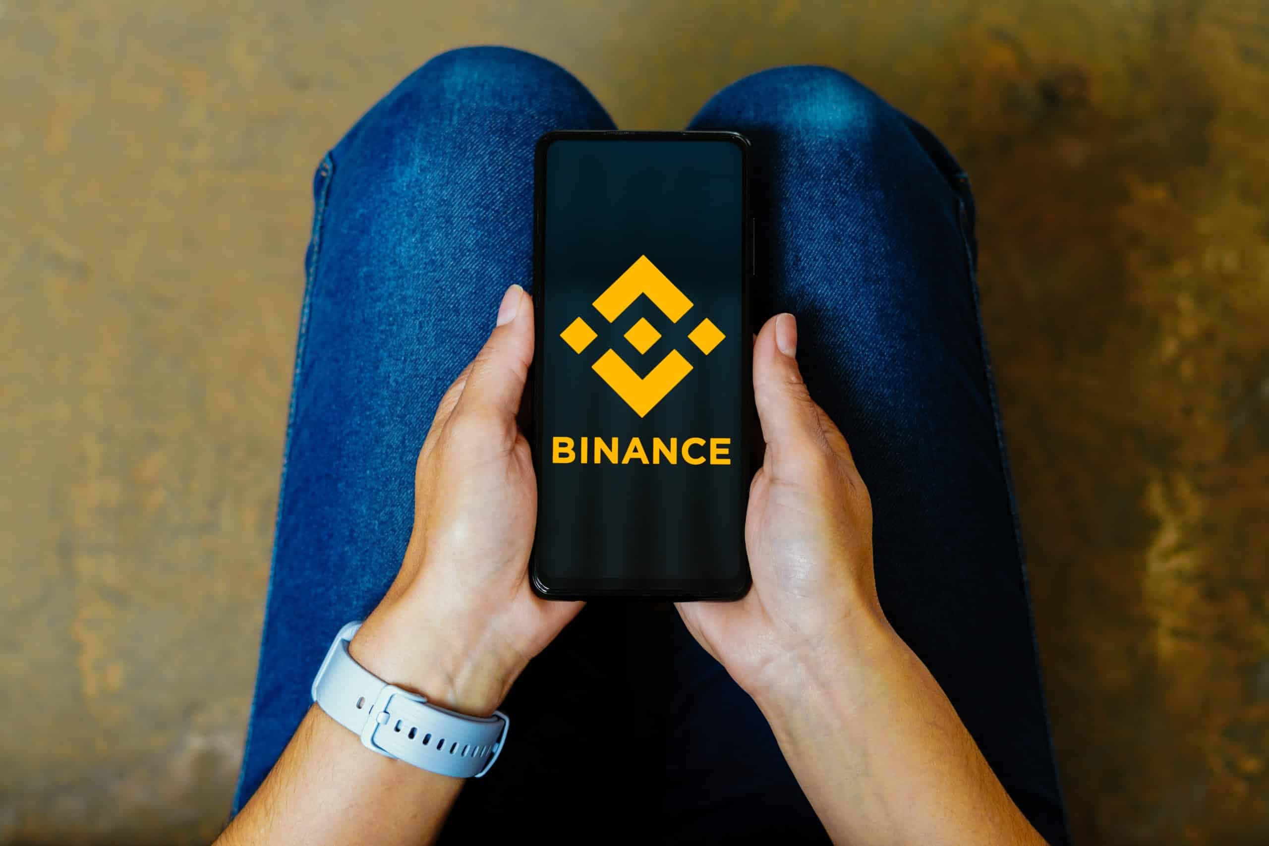 In this photo illustration, the Binance logo is displayed on