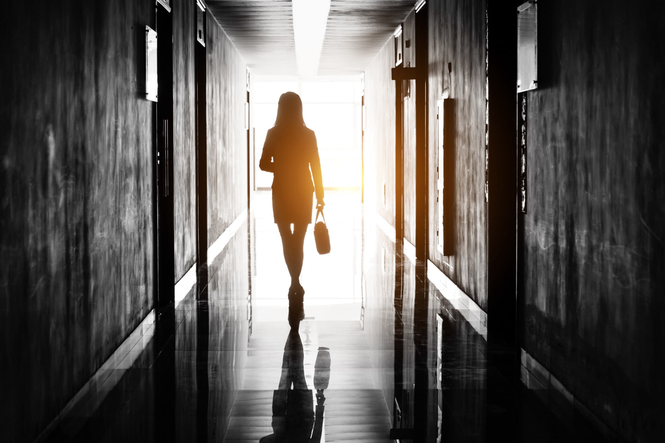 Businesswoman through the office corridor